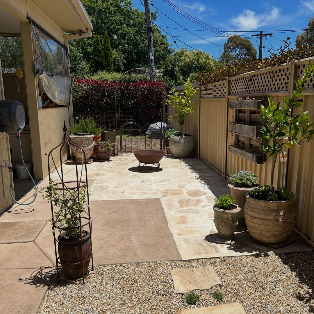 Paved courtyard with stone flagging and gravel border
